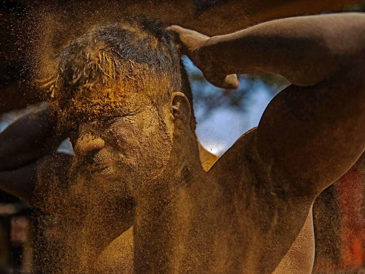 Before and after each wrestling match, Kushti wrestlers rub a special mix of dirt and other ingredients into their skin.